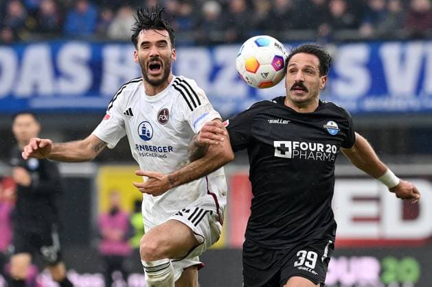 Paderborn, Home Deluxe Arena, 11.11.23, GER, Herren, 2.Bundesliga, Saison 2023-2024, SC Paderborn 07 - 1.FC Nuernberg Bild: v.li. im Zweikampf Ivan MARQUEZ (Nuernberg) und Adriano GRIMALDI (Paderborn) Only for editorial use! DFL regulations prohibit any use of photographs as image sequences and or quasi-video. NRW Deutschland