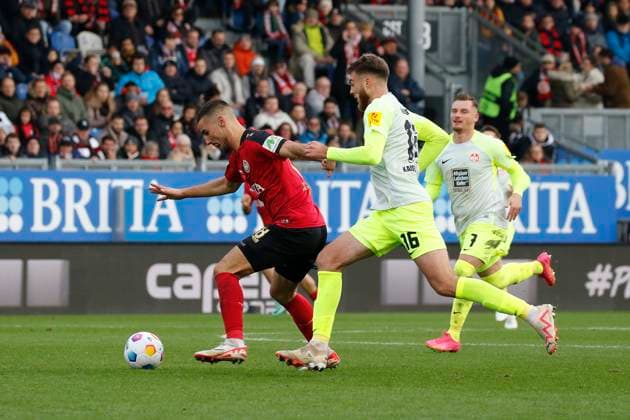 12.11.2023, xavx, Fussball 2.Bundesliga, SV Wehen Wiesbaden - 1.FC Kaiserslautern emspor, v.l. Ivan Prtajin (SV Wehen Wiesbaden), Julian Niehues (1.FC Kaiserslautern), Marlon Ritter (1.FC Kaiserslautern) (DFL DFB REGULATIONS PROHIBIT ANY USE OF PHOTOGRAPHS as IMAGE SEQUENCES and or QUASI-VIDEO) Wiesbaden
