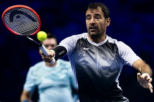 Nitto ATP, Tennis Herren Finals - Day One Ivan Dodig of Croatia plays a forehand next to Austin Krajicek of USA during the round robin doubles match against Andres Molteni and Maximo Gonzalez of Argentina during day one of the Nitto ATP Finals. Ivan Dodig and Austin Krajicek won the match 6-4, 6-2. Turin Italy Copyright: xNicolòxCampox