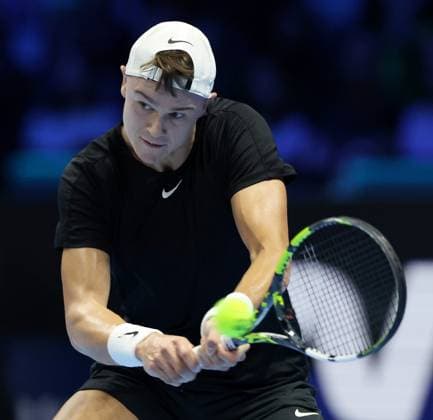 (231113) -- TURIN, Nov. 13, 2023 -- Holger Rune hits a return during the the group stage match between Novak Djokovic of Serbia and Holger Rune of Norway at ATP, Tennis Herren Finals tennis tournament in Turin, Italy, on Nov. 12, 2023. (Photo by Xinhua) (SP)ITALY-TURIN-TENNIS-ATP FINALS FedericoxTardito 