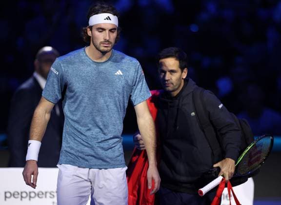 (231115) -- TURIN, Nov. 15, 2023 -- Stefanos Tsitsipas reacts after quitting the group stage match between Stefanos Tsitsipas of Greece and Holger Rune of Denmark at ATP, Tennis Herren Finals tennis tournament in Turin, Italy, on Nov. 14, 2023. (Photo by Xinhua) (SP)ITALY-TURIN-TENNIS-ATP FINALS AlbertoxLingria 