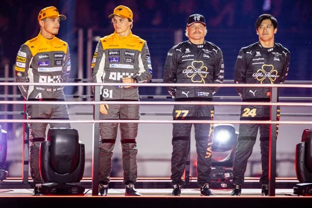 LAS VEGAS, NV - NOVEMBER 15: McLaren driver Lando Norris (4) of United Kingdom and McLaren driver Oscar Piastri (81) of Australia stand with Alfa Romeo driver Valtteri Bottas (77) of Finland and Alfa Romeo driver Zhou Guanyu (24) of China during the opening ceremony of the F1 Las Vegas Grand Prix on Wednesday, November 15 on the Las Vegas Street Circuit in Las Vegas, NV. (Photo by Bob Kupbens Icon Sportswire) AUTO: NOV 15 F1 Las Vegas Grand Prix EDITORIAL USE ONLY Icon231115034
