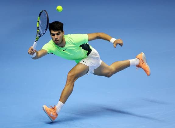 (231118) -- TURIN, Nov. 18, 2023 -- Carlos Alcaraz hits a return during the group stage match between Carlos Alcaraz of Spain and Daniil Medvedev of Russia at ATP, Tennis Herren Finals tennis tournament in Turin, Italy, Nov. 17, 2023. (Photo by Xinhua) (SP)ITALY-TURIN-TENNIS-ATP FINALS AugustoxCasasoli 