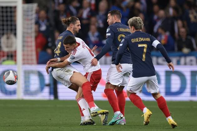 Nice, France, 18th November 2023. Theo Hernandez and Antoine Griezmann of France look on as team mate Adrien Rabiot clashes with Nicholas Pozo of Gibraltar during the UEFA European Championship, EM, Europameisterschaft Qualifying match at Allianz Riviera Stadium, Nice. Picture credit should read: Jonathan Moscrop Sportimage EDITORIAL USE ONLY. No use with unauthorised audio, video, data, fixture lists, club league logos or live services. Online in-match use limited to 120 images, no video emulation. No use in betting, games or single club league player publications. SPI-2730-0010
