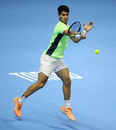(231119) -- TURIN, Nov. 19, 2023 -- Carlos Alcaraz of Spain hits a return during the semifinal match between Carlos Alcaraz of Spain and Novak Djokovic of Serbia at ATP, Tennis Herren Finals tennis tournament in Turin, Italy, Nov. 18, 2023. (Photo by Xinhua) (SP)ITALY-TURIN-TENNIS-ATP FINALS AlbertoxLingria 