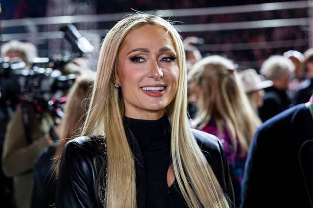 LAS VEGAS, NV - NOVEMBER 18: Paris Hilton walks on the grid before the F1 Las Vegas Grand Prix on Saturday, November 18, 2023 on the Las Vegas Street Circuit in Las Vegas, NV. (Photo by Bob Kupbens Icon Sportswire) AUTO: NOV 18 F1 Las Vegas Grand Prix EDITORIAL USE ONLY Icon231118041