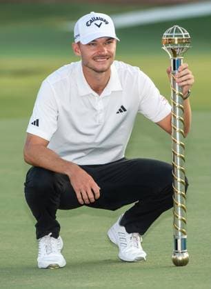NICOLAI HoJGAARD of Denmark holds the trophy after winning DP World Tour Championship in Dubai, United Arab Emirates, Nov 19, 2023. Dubai United Arab Emirates  Copyright: xMARTINxDOKOUPILx 441_4487
