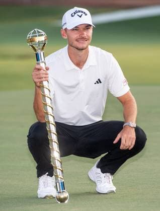 NICOLAI HoJGAARD of Denmark holds the trophy after winning DP World Tour Championship in Dubai, United Arab Emirates, Nov 19, 2023. Dubai United Arab Emirates  Copyright: xMARTINxDOKOUPILx 441_4509