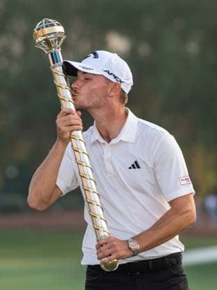 NICOLAI HoJGAARD of Denmark kisses the trophy after winning DP World Tour Championship in Dubai, United Arab Emirates, Nov 19, 2023. Dubai United Arab Emirates  Copyright: xMARTINxDOKOUPILx 441_4530