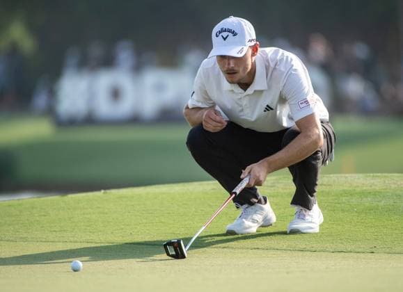 NICOLAI HoJGAARD of Denmark checks the 17th green during DP World Tour Championship in Dubai, United Arab Emirates, Nov 19, 2023. Dubai United Arab Emirates  Copyright: xMARTINxDOKOUPILx 443_2035