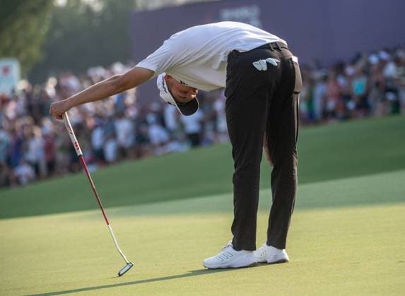 NICOLAI HoJGAARD of Denmark reacts after missing a putt on the 18th green during DP World Tour Championship in Dubai, United Arab Emirates, Nov 19, 2023. Dubai United Arab Emirates  Copyright: xMARTINxDOKOUPILx 443_2122