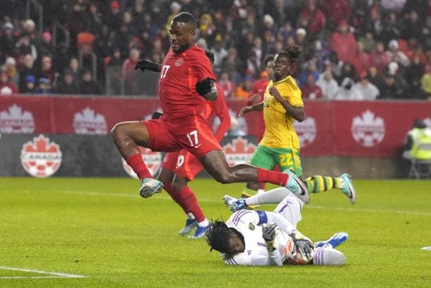 November 21, 2023, TORONTO, ON, CAN: Canada s Cyle Larin hurdles Jamaica goalkeeper Andre Blake during first half CONCACAF Nations League quarterfinals action in Toronto, on Tuesday, November 21, 2023. Cyle Larin ; Andre Blake  - ZUMAc35_ 20231121_zaf_c35_202 Copyright: xChrisxYoungx