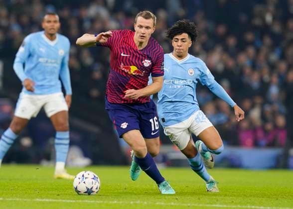 Manchester, England, 28th November 2023. Lukas Klostermann of RB Leipzig tussles with Rico Lewis of Manchester City during the UEFA Champions League match at the Etihad Stadium, Manchester. Picture credit should read: Andrew Yates Sportimage EDITORIAL USE ONLY. No use with unauthorised audio, video, data, fixture lists, club league logos or live services. Online in-match use limited to 120 images, no video emulation. No use in betting, games or single club league player publications. SPI-2749-0021