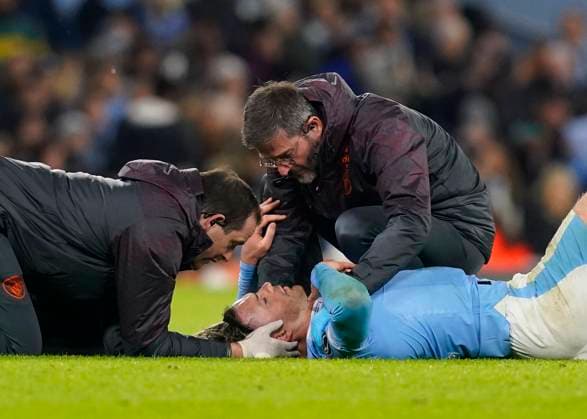 Manchester, England, 28th November 2023. Jack Grealish of Manchester City is checked for concussion during the UEFA Champions League match at the Etihad Stadium, Manchester. Picture credit should read: Andrew Yates Sportimage EDITORIAL USE ONLY. No use with unauthorised audio, video, data, fixture lists, club league logos or live services. Online in-match use limited to 120 images, no video emulation. No use in betting, games or single club league player publications. SPI-2749-0030