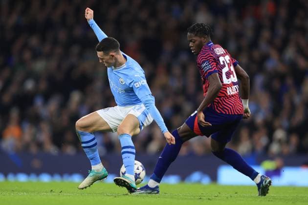 Manchester City v RB Leipzig 28 November 2023 - UEFA Champions League - Group G - Manchester City v RB Leipzig - Phil Foden of Manchester City and Castello Lukeba of RB Leipzig - Photo: Simon Stacpoole Offside. Manchester UK Copyright: xSimonxStacpoolexOffside