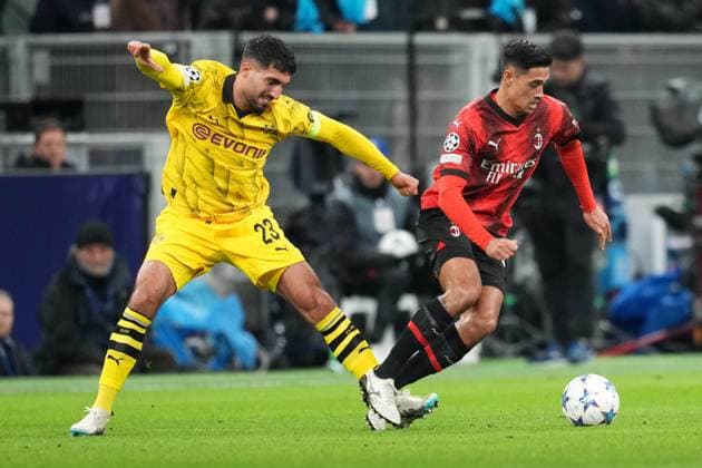MILAN, ITALY - NOVEMBER 28: Tijjani Reijnders of Milan (R) against Emre Can of Dortmund (L) during the UEFA Champions League Group Stage match between AC Milan and Borussia Dortmund at Stadio Giuseppe Meazza on November 28, 2023 in Milan, Italy. Milan Stadio Giuseppe Meazza Italy Copyright: xJustPictures.ch JarixPestelaccix jp-en-EuSpIm-Milan_Dortmund_28Nov2023_JAR_00029