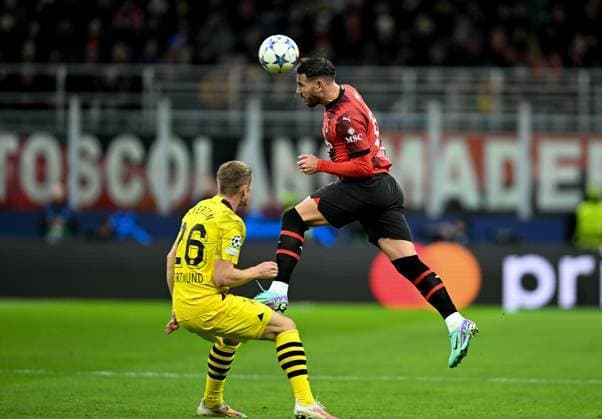 (231129) -- MILAN, Nov. 29, 2023 -- Milan s Theo Hernandez (R) vies with Borussia Dortmund s Julian Ryerson during the UEFA Champions League Group F match between AC Milan and Borussia Dortmund in Milan, Italy, Nov. 28, 2023. (Photo by Xinhua) (SP)ITALY-MILAN-FOOTBALL-UEFA CHAMPIONS LEAGUE-AC MILAN VS BORUSSIA DanielexMascolo 