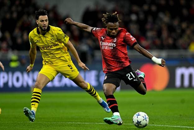 (231129) -- MILAN, Nov. 29, 2023 -- Milan s Samuel Chukwueze (R) vies with Borussia Dortmund s Ramy Bensebaini during the UEFA Champions League Group F match between AC Milan and Borussia Dortmund in Milan, Italy, Nov. 28, 2023. (Photo by Xinhua) (SP)ITALY-MILAN-FOOTBALL-UEFA CHAMPIONS LEAGUE-AC MILAN VS BORUSSIA DanielexMascolo 