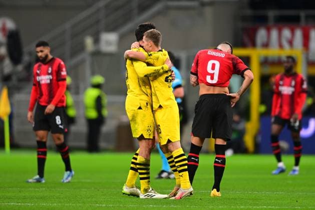 Italy, Mailand, 28.11.2023, San Siro Stadium, AC Milan-Borussia Dortmund - UEFA Champions League 2023 2024 - Group F, Emre Can of Borussia Dortmund and Julien Duranville of Borussia Dortmund celebrate after winning Milan San Siro Stadium Lombardy Italy