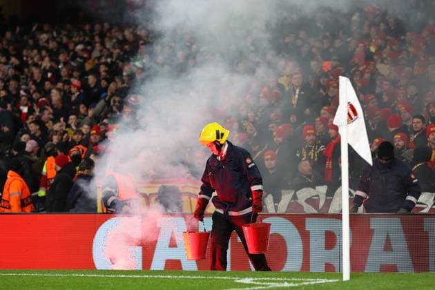 Arsenal v Lens 29 November 2023, London - Champion™s League Football, Group B - Arsenal v Lens - A fire marshal removes a flare - Photo: Charlotte Wilson Offside. London UK Copyright: xCharlottexWilsonx xOffsidexOffside