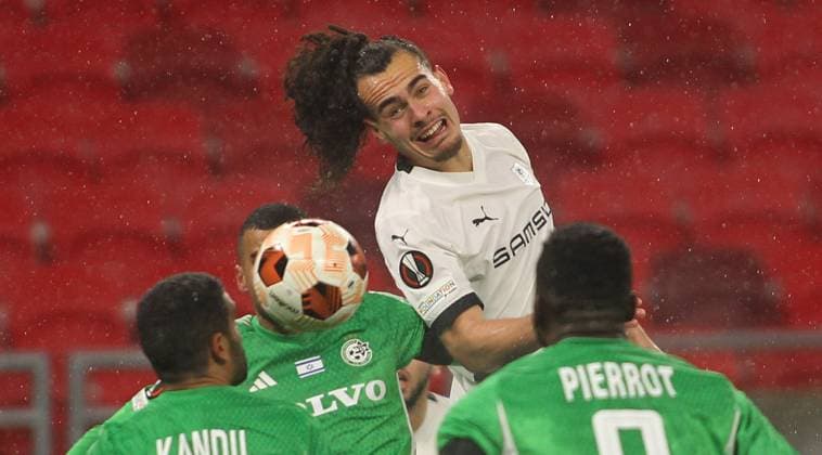 Arthur Theate(C) FC Stade Rennais between Maccabi Haifa players FOOTBALL : Maccabi Haifa Vs Stade Rennais - Ligue Europa - 30 11 2023 AleksandarDjorovic Panoramic 