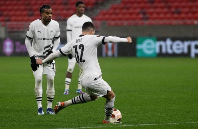 Fabian Rieder(C) beside Lorenz Assignon (L) FC Stade Rennais scores third goal on match FOOTBALL : Maccabi Haifa Vs Stade Rennais - Ligue Europa - 30 11 2023 AleksandarDjorovic Panoramic 