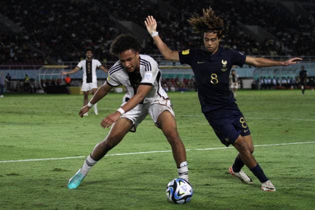 December 2, 2023, Surakarta, Central Java, Indonesia: SAIMON BOUABRE of France (R) vies with ERIC DA SIVA MOREIRA of Germany during FIFA U-17 World Cup Final match between Germany and France at Manahan Stadium. Surakarta Indonesia - ZUMAb228 0370475832st Copyright: xAnggaxBudhiyantox