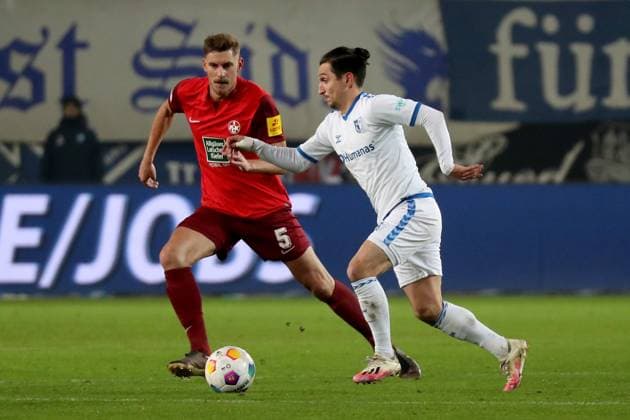 02.12.2023, xgox, Fussball 2.Bundesliga, 1.FC Magdeburg - 1.FC Kaiserslautern emspor, v.l. Kevin Kraus (1. FC Kaiserslautern) Baris Atik (1.FC Magdeburg) Zweikampf, Aktion, action, battle for the ball (DFL DFB REGULATIONS PROHIBIT ANY USE OF PHOTOGRAPHS as IMAGE SEQUENCES and or QUASI-VIDEO) Magdeburg