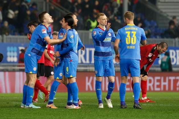 08.12.2023, xavx, Fussball 2.Bundesliga, SV Wehen Wiesbaden - Eintracht Braunschweig emspor, v.l. Ermin Bicakcic (Eintracht Braunschweig), Rayan Philippe (Eintracht Braunschweig) jubeln jubelt nach Spielende. (DFL DFB REGULATIONS PROHIBIT ANY USE OF PHOTOGRAPHS as IMAGE SEQUENCES and or QUASI-VIDEO) Wiesbaden