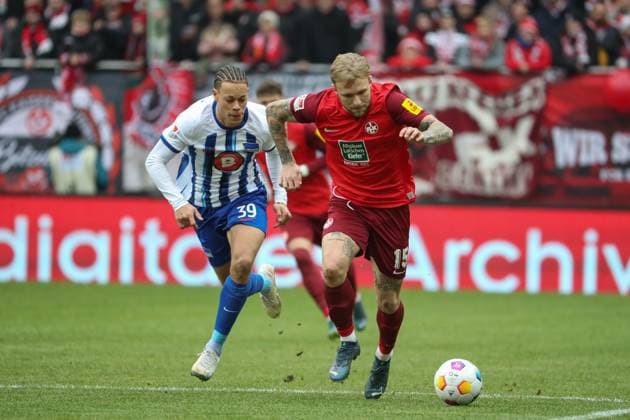 09.12.2023, xusrbx, Fussball 2.Bundesliga, 1.FC Kaiserslautern - Hertha BSC Berlin emspor, v.l. Derry Scherhant (Herta BSC, 39), Tymoteusz Puchacz (1. FC Kaiserslautern, 15), (DFL DFB REGULATIONS PROHIBIT ANY USE OF PHOTOGRAPHS as IMAGE SEQUENCES and or QUASI-VIDEO) Kaiserslautern