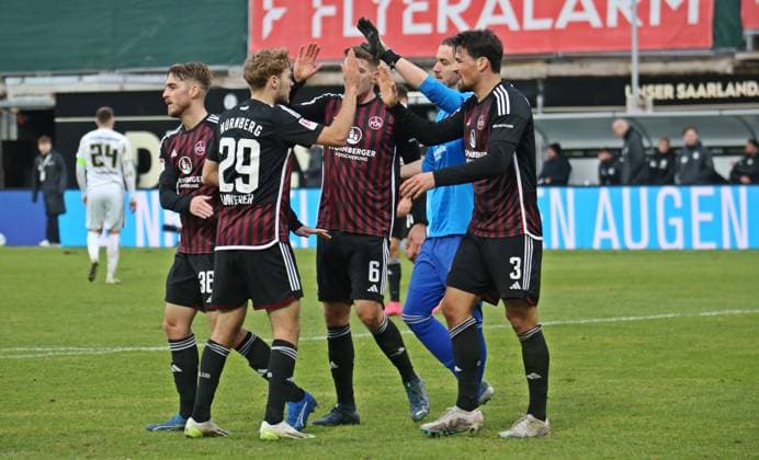 10.12.2023, xmohx, Fussball 2.Bundesliga, SV Elversberg - 1.FC Nürnberg emspor, v.l. Nürnberg bejubelt den Sieg (DFL DFB REGULATIONS PROHIBIT ANY USE OF PHOTOGRAPHS as IMAGE SEQUENCES and or QUASI-VIDEO) Elversberg