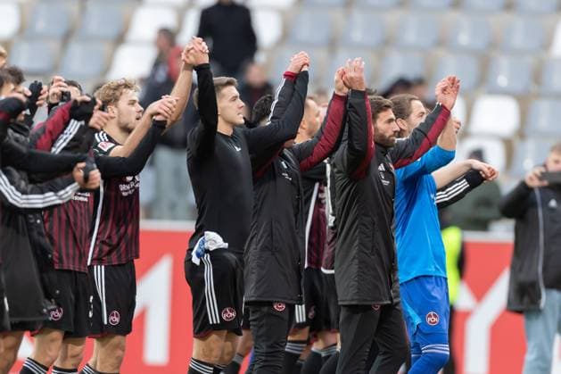 Germany, Spiesen-Elversberg, 10.12.2023, Waldstadion Kaiserlinde, SV Elversberg vs FC Nürnberg - 2. Bundesliga, 16. Spieltag, . The players of 1.FC Nuernberg celebrate after winning Spiesen-Elversberg URSAPHARM-Arena an der Kaiserlinde Saarland Germany