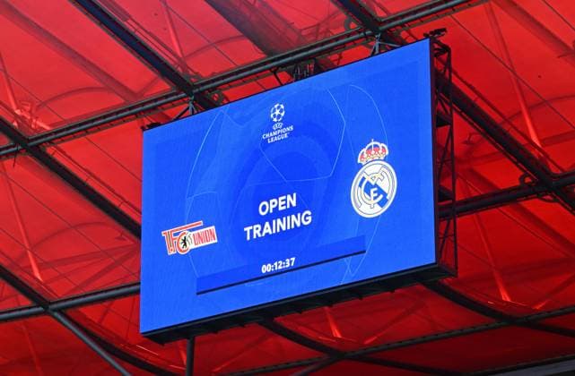 Fussball, Herren, Saison 2023 2024, UEFA Champions League (Gruppe C, 6. Spieltag), 1. FC Union Berlin - Real Madrid, Pressekonferenz Training von Real Madrid im Olympiastadion am Tag vor dem Spiel, im Bild: Anzeigetafel mit Paarung, 11.12. 2023, Copyright: xMatthiasxKochx