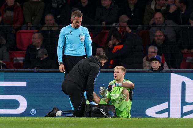 Aaron Ramsdale of Arsenal receives treatment for an injury PSV Eindhoven v Arsenal, UEFA Champions League, Group B, Football, Philips Stadion, Eindhoven, Netherlands - 12 Dec 2023 EDITORIAL USE ONLY No use with unauthorised audio, video, data, fixture lists, club league logos or live services. Online in-match use limited to 120 images, no video emulation. No use in betting, games or single club league player publications. Copyright: xPaulxCurrie Shutterstockx 14254183ag