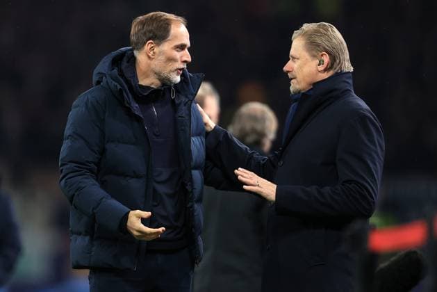 Football - UEFA Champions League - Group A - Manchester United, ManU v Bayern Munich 12th December 2023 - UEFA Champions League - Group A - Manchester United v Bayern Munich - Bayern Munich coach Thomas Tuchel greets pundit Peter Schmeichel - Photo: Simon Stacpoole Offside. Manchester UK Copyright: xSimonxStacpoolexOffside