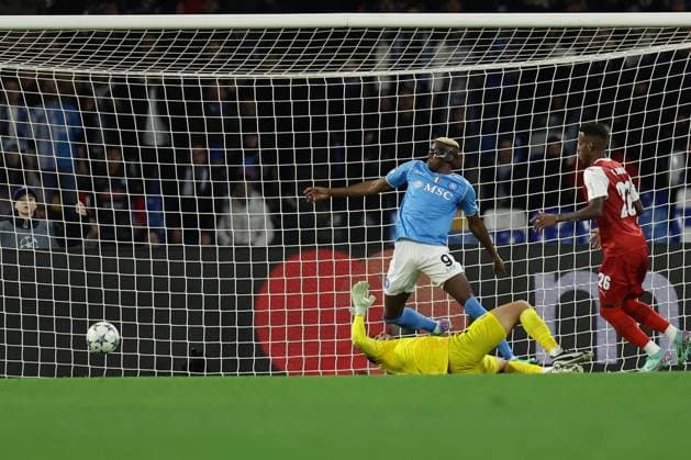 Champions League match SSC Napoli vs Braga SSC Napoli s Nigerian forward Victor Osimhen scores against Braga s Brazilian goalkeeper Matheus Magalhaes during the Uefa champions league match between SSC Napoli vs Braga at the Diego Armando Maradona Stadium in Naples, southern Italy, on December 12, 2023. ABPH6173 Copyright: xAntonioxBalascox