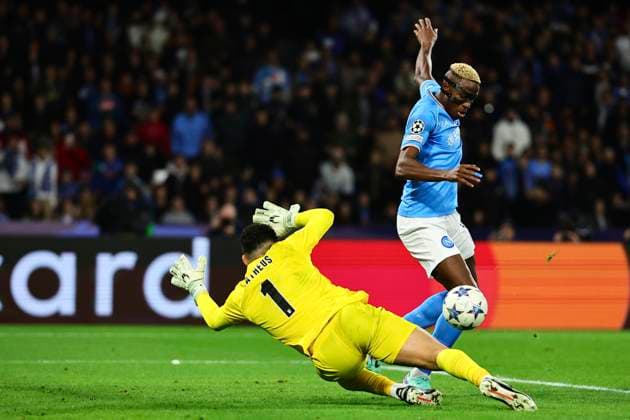 Victor Osimhen of SSC Napoli past Matheus Lima Magalhaes of SC Braga and scores the goal of 2-0 during the Champions League Group C football match between SSC Napoli and SC Braga at Diego Armando Maradona stadium in Naples (Italy), December 12th, 2023. cesarexpurini