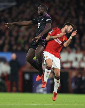 Football - UEFA Champions League - Group A - Manchester United, ManU v Bayern Munich 12th December 2023 - UEFA Champions League - Group A - Manchester United v Bayern Munich - Dayot Upamecano of Bayern Munich and Bruno Fernandes of Manchester United - Photo: Simon Stacpoole Offside. Manchester UK Copyright: xSimonxStacpoolexOffside