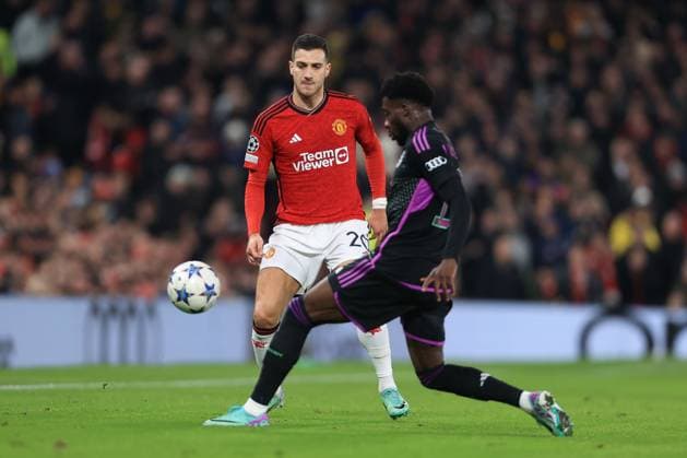 Football - UEFA Champions League - Group A - Manchester United, ManU v Bayern Munich 12th December 2023 - UEFA Champions League - Group A - Manchester United v Bayern Munich - Diogo Dalot of Manchester United chips the ball - Photo: Simon Stacpoole Offside. Manchester UK Copyright: xSimonxStacpoolexOffside