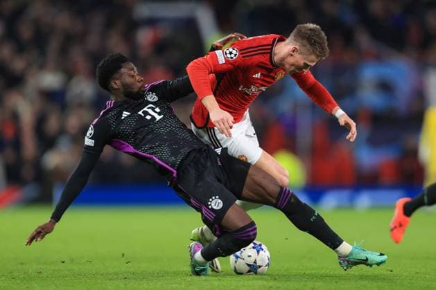 Football - UEFA Champions League - Group A - Manchester United, ManU v Bayern Munich 12th December 2023 - UEFA Champions League - Group A - Manchester United v Bayern Munich - Alphonso Davies of Bayern Munich tackles Scott McTominay of Manchester United - Photo: Simon Stacpoole Offside. Manchester UK Copyright: xSimonxStacpoolexOffside