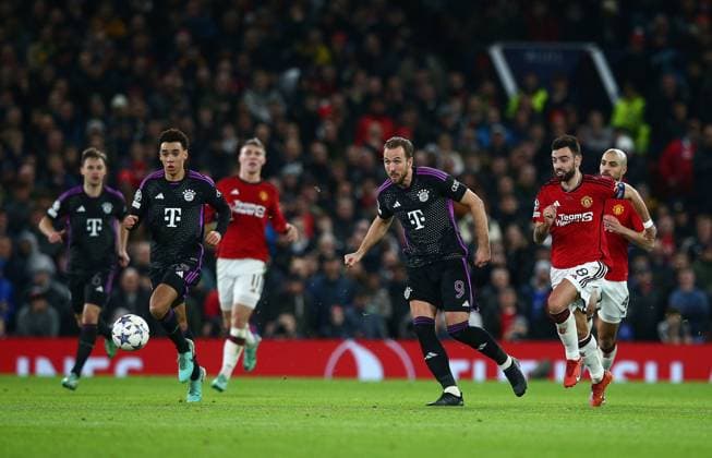Harry Kane of Bayern Munich passes the ball Manchester United, ManU v Bayern Munich, UEFA Champions League, Group A, Football, Old Trafford, Manchester, UK - 12 Dec 2023 EDITORIAL USE ONLY No use with unauthorised audio, video, data, fixture lists, club league logos or live services. Online in-match use limited to 120 images, no video emulation. No use in betting, games or single club league player publications. Copyright: xMattxWest Shutterstockx 14254194az