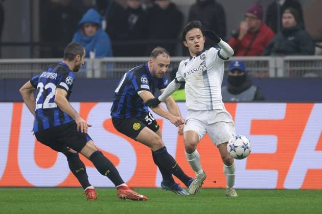 Milan, Italy, 12th December 2023. Henrikh Mkhitaryan of FC Internazionale closes in as Davide Frattesi of FC Internazionale tussles with Takefusa Kubo of Real Sociedad during the UEFA Champions League match at Giuseppe Meazza, Milan. Picture credit should read: Jonathan Moscrop Sportimage EDITORIAL USE ONLY. No use with unauthorised audio, video, data, fixture lists, club league logos or live services. Online in-match use limited to 120 images, no video emulation. No use in betting, games or single club league player publications. SPI-2786-0005
