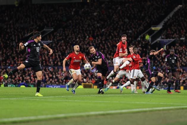Football - UEFA Champions League - Group A - Manchester United, ManU v Bayern Munich 12th December 2023 - UEFA Champions League - Group A - Manchester United v Bayern Munich - Jonny Evans of Manchester United deflects a cross from Kim Min-Jae of Bayern Munich before Harry Kane can make a shot - Photo: Simon Stacpoole Offside. Manchester UK Copyright: xSimonxStacpoolexOffside