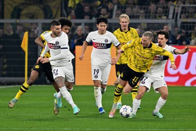 13.12.2023, xsltx, Fussball UEFA Champions League, Borussia Dortmund - Paris St.Germain PSG emspor, v.l. Lucas Hernandez (FC Paris Saint-Germain) Kang-in Lee (FC Paris Saint-Germain) Marco Reus (Borussia Dortmund) Vitinha (FC Paris Saint-Germain) Zweikampf, Aktion, action, battle for the ball (DFL DFB REGULATIONS PROHIBIT ANY USE OF PHOTOGRAPHS as IMAGE SEQUENCES and or QUASI-VIDEO) Dortmund