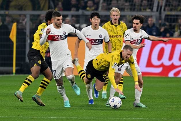 13.12.2023, xsltx, Fussball UEFA Champions League, Borussia Dortmund - Paris St.Germain PSG emspor, v.l. Lucas Hernandez (FC Paris Saint-Germain) Kang-in Lee (FC Paris Saint-Germain) Marco Reus (Borussia Dortmund) Vitinha (FC Paris Saint-Germain) Zweikampf, Aktion, action, battle for the ball (DFL DFB REGULATIONS PROHIBIT ANY USE OF PHOTOGRAPHS as IMAGE SEQUENCES and or QUASI-VIDEO) Dortmund