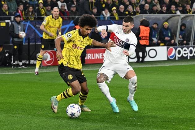 13.12.2023, xsltx, Fussball UEFA Champions League, Borussia Dortmund - Paris St.Germain PSG emspor, v.l. Karim Adeyemi (Borussia Dortmund) Lucas Hernandez (FC Paris Saint-Germain) Zweikampf, Aktion, action, battle for the ball (DFL DFB REGULATIONS PROHIBIT ANY USE OF PHOTOGRAPHS as IMAGE SEQUENCES and or QUASI-VIDEO) Dortmund