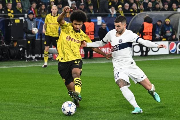 13.12.2023, xsltx, Fussball UEFA Champions League, Borussia Dortmund - Paris St.Germain PSG emspor, v.l. Karim Adeyemi (Borussia Dortmund) Lucas Hernandez (FC Paris Saint-Germain) Zweikampf, Aktion, action, battle for the ball (DFL DFB REGULATIONS PROHIBIT ANY USE OF PHOTOGRAPHS as IMAGE SEQUENCES and or QUASI-VIDEO) Dortmund