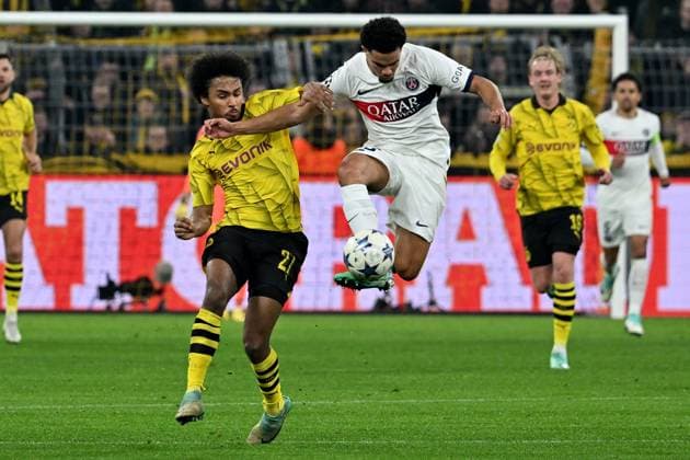 13.12.2023, xsltx, Fussball UEFA Champions League, Borussia Dortmund - Paris St.Germain PSG emspor, v.l. Karim Adeyemi (Borussia Dortmund) Waren Zaire-Emery (FC Paris Saint-Germain) Zweikampf, Aktion, action, battle for the ball (DFL DFB REGULATIONS PROHIBIT ANY USE OF PHOTOGRAPHS as IMAGE SEQUENCES and or QUASI-VIDEO) Dortmund