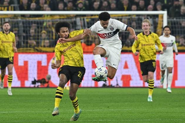 13.12.2023, xsltx, Fussball UEFA Champions League, Borussia Dortmund - Paris St.Germain PSG emspor, v.l. Karim Adeyemi (Borussia Dortmund) Waren Zaire-Emery (FC Paris Saint-Germain) Zweikampf, Aktion, action, battle for the ball (DFL DFB REGULATIONS PROHIBIT ANY USE OF PHOTOGRAPHS as IMAGE SEQUENCES and or QUASI-VIDEO) Dortmund