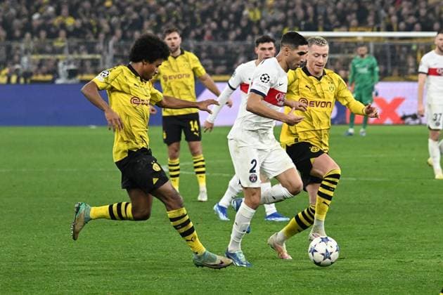 13.12.2023, xsltx, Fussball UEFA Champions League, Borussia Dortmund - Paris St.Germain PSG emspor, v.l. Karim Adeyemi (Borussia Dortmund) Achraf Hakimi (FC Paris Saint-Germain) Marco Reus (Borussia Dortmund) Zweikampf, Aktion, action, battle for the ball (DFL DFB REGULATIONS PROHIBIT ANY USE OF PHOTOGRAPHS as IMAGE SEQUENCES and or QUASI-VIDEO) Dortmund